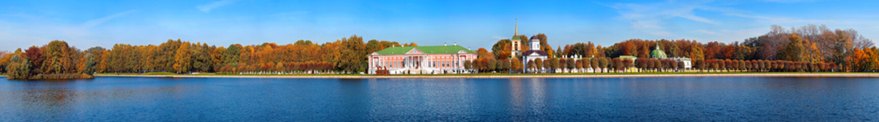 Panoramic wide angle view of pond reflections of historic Kuskovo buildings and sunny autumn park