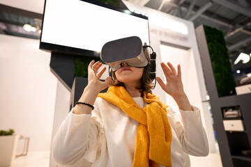 Woman uses virtual reality glasses
