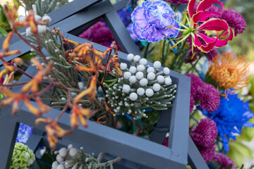 bouquet of brunia flower blue-violet carnation or dianthus and other exotic flowers in a contemporary assembled bouquet. Modern floristry