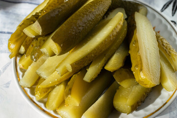 Sliced green pickles on a plate on the table