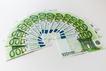 Fanned out 100 Euro banknotes as background image for financial topics.