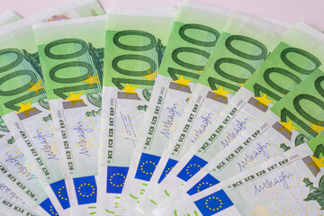 Fanned out 100 Euro banknotes as background image for financial topics.