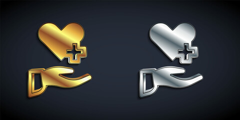 Gold and silver Heart with a cross icon isolated on black background. First aid. Healthcare, medical and pharmacy sign. Long shadow style. Vector