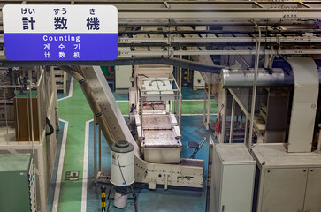 Coin-counting machine working at coin production line in Japan Mint