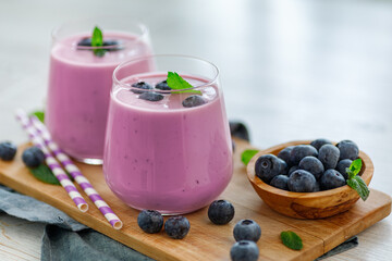 Vegan smoothie with fresh blueberries in glass jar. Healthy food.