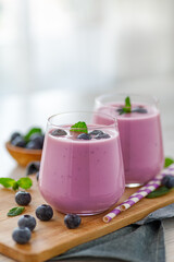 Vegan smoothie with fresh blueberries in glass jar. Healthy food.
