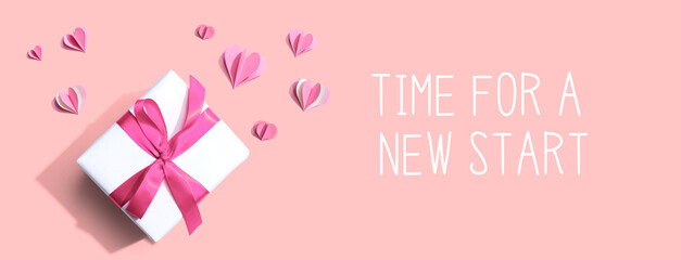Time for a new start message with a gift box and paper hearts