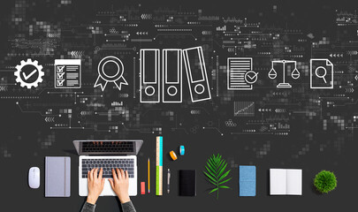 Compliance theme with person using a laptop computer