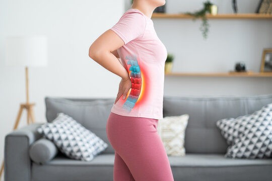 Lumbar intervertebral spine hernia, woman with back pain at home, spinal disc disease