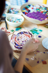 The process of creating a flower from a mosaic.