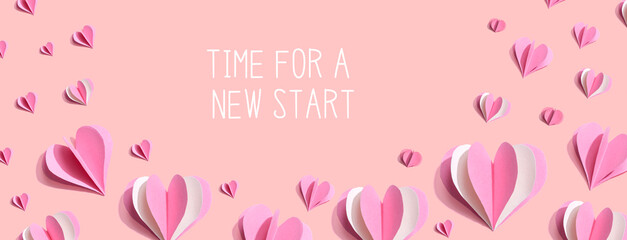 Time for a new start message with pink paper hearts - flat lay