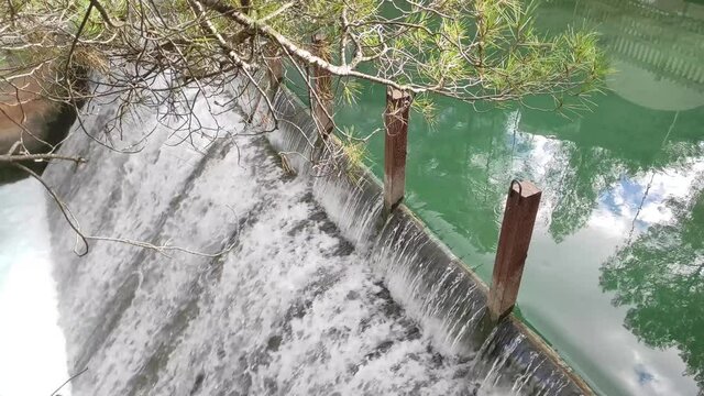 Small waterfall on the river in parkland