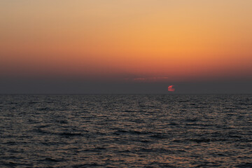 Fototapeta premium sunset sea dominicana,sun sets in the ocean landscape,background from the beach