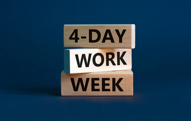 4-day work week symbol. Concept words '4-day work week' on wooden blocks. Beautiful grey background. Copy space. Business and 4-day work week concept.