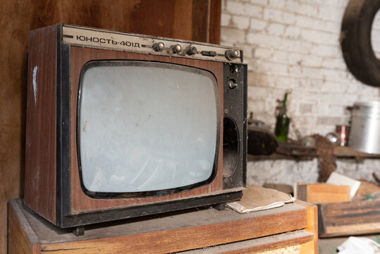 Siedlce, Poland - August 16, 2020: Old TV and radio set under a layer of dust. Electronics from the previous era.