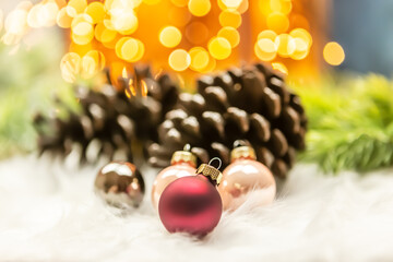 Christmas deco scene: Different small christmas baubles in front of a festive background