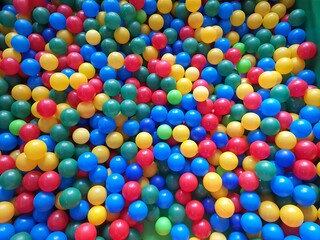 Ball pool: small colored plastic for children to play, backgrounds and textures.