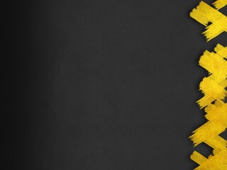 マットな質感の黒い紙と華やかな金色の模様の背景