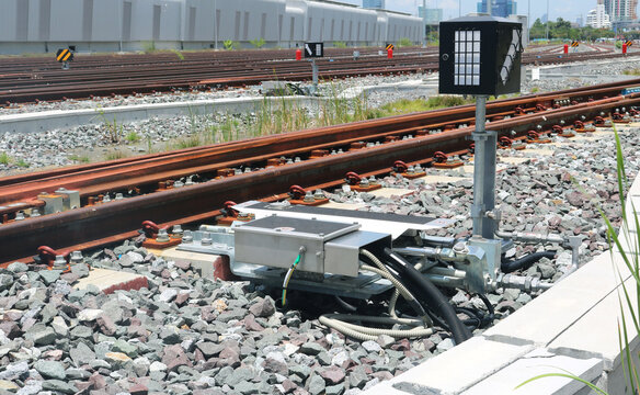 Point machine turnout control with signalling light installed on the railway.
