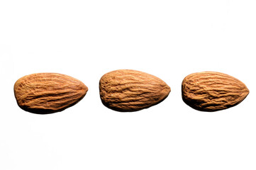 several almonds on a white background. close-up. view from above.