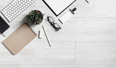 Stationery on wooden background. Copy space for your text. Flat lay.