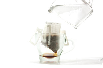 hot water fall into  a one bag open filter  to make american coffee