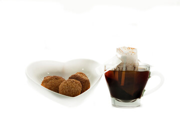 Glassware of heart shape bowl and mug isolated on white background open bag filter to make american coffee with 3 bread cheese balls Brazilian food  in Mexico city good morning