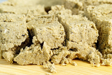 Sliced sunflower halva on the table. Delicious food. Close up macro