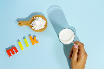 Vegan dry milk blue background. Space for copying text