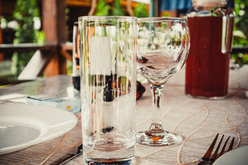 Clean dishes stand on a table in a restaurant