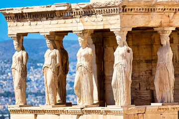 Detail of Caryatid Porch on the Acropolis, Athens, Greece. Ancient Erechtheion or Erechtheum temple. World famous landmark at the Acropolis Hill. - obrazy, fototapety, plakaty