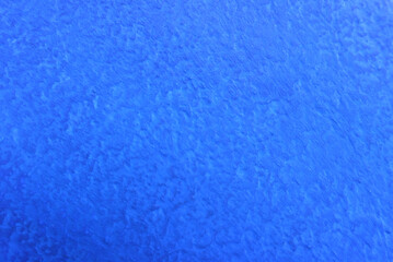 Fototapeta na wymiar Seamless texture of painted dark blue cement old wall a rough surface, with space for text, for a background..