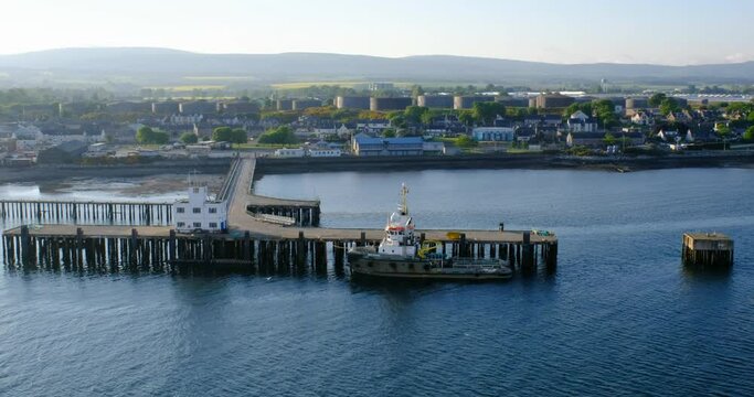 Aerial view of the pier and fishing seiner in the Cromarty Firth in Invergordon, Scotland, United Kingdom