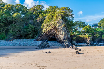 A view up Glen Beach towards a cliff anticline at Saundersfoot, South Wales on a sunny day