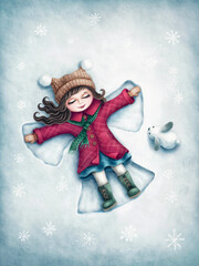 Girl making a snow angel in snow