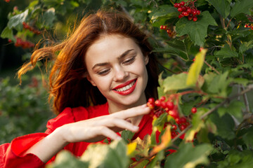 women near bushes nature berries summer lifestyle