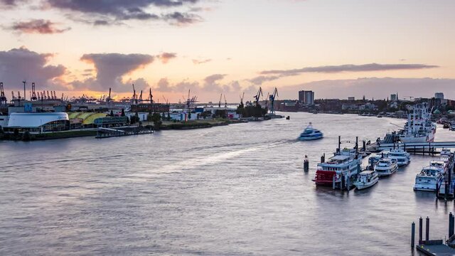 Hamburg, Germany (4k): Time lapse, skyline of the harbor of Hamburg, view from the Elbphilharmonie, sunset, zoom in