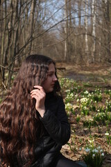 girl among snowdrops