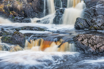 Waterfall in the canyon. Ruskeala Mountain Park. Republic of Karelia.