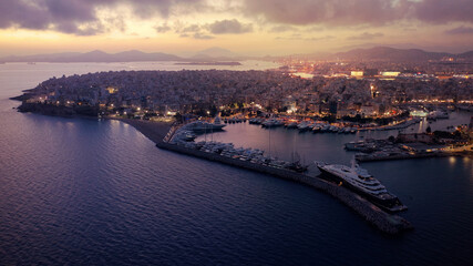Aerial drone photo of iconic round port and Marina of Zea or Passalimani at dusk with beautiful colours, Piraeus, Attica, Greece