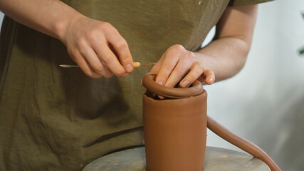 Male Hands Shaping a Jar on the Potter's Wheel, Close-up Crafting Process