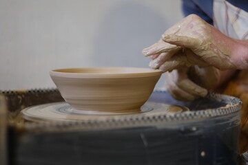 the man behind the potter's wheel