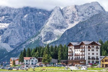 Fototapeta premium Misurina Lake in calm water. Stunning view on the majestic Dolomites Alp Mountains, Italy, National Park Tre Cime di Lavaredo.