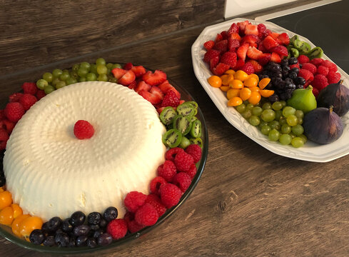 Cream pudding with several fruits and berries