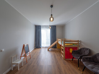 Modern interior of children's room. Wooden bed with stairs.