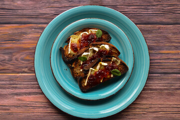 Toasted bread with baked Brie cheese and chilli jam