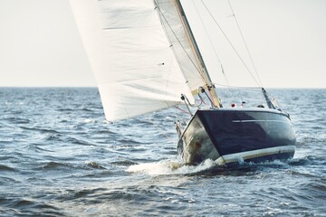 Heeled sloop rigged yacht sailing in an open Baltic sea on a clear day. Regatta, racing, sport,...