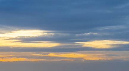 Naklejka na ściany i meble Dark sky with blue clouds at sunset