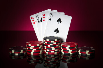 Poker game with two pairs combination. Chips and cards on table. Successful and win
