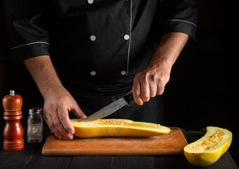 Cook cuts ripe yellow marrow with a knife. Fried zucchini is a great diet for breakfast or lunch. Work environment on the kitchen table of the restaurant